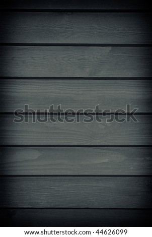 Blank gloomy dark graphite toned boards texture abstract with dark vignette, planks surface background in vertical orientation, nobody