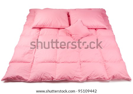 Pink cotton fluffy three pillows on big duvet without cover, eiderdown filled with fluff or feathers, objects isolated on white background, horizontal orientation, nobody.