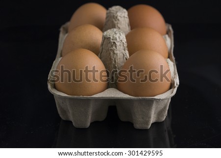 Eggs in paper plates with black  background
