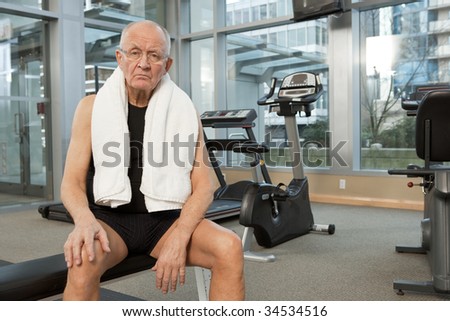 Man in gym with towel