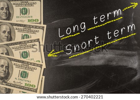 Text on blackboard with money - Long term and short term