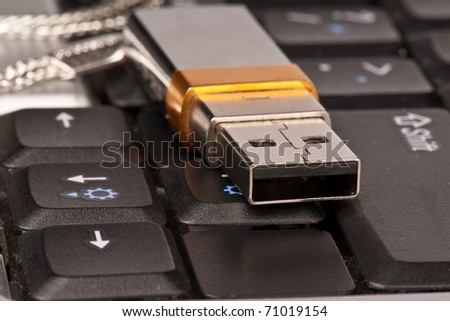 USB stick resting on a laptop keyboard