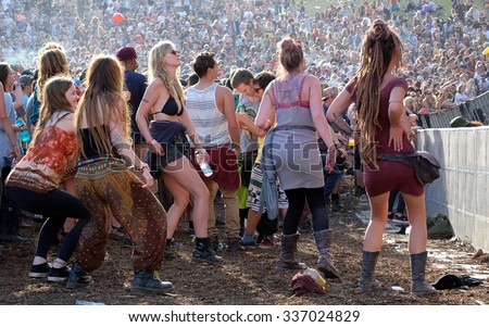 Boomtown Fair Festival  -  August 15 2015:   Crowd of youth dancing to reggae music at Boomtown Fair Festival, Matterley Bowl, Winchester, Hampshire, August 15 2015, in Hampshire, UK