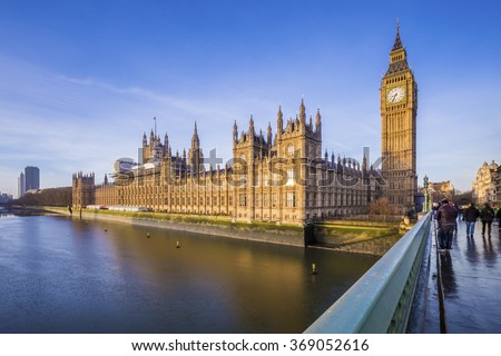 Houses of Parliament and Big Ben with River Thames on an early morning shot in central London, UK