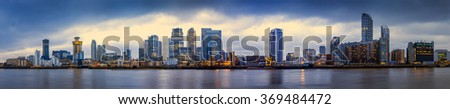 Wide panoramic skyline of Canary Wharf, the worlds leading financial district at blue hour - London, UK