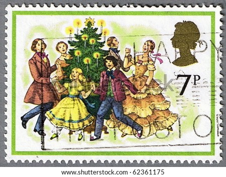 GREAT BRITAIN - CIRCA 1978: A stamp printed in Great Britain shows dancing around the Christmas tree, series is devoted to Christmas, circa 1978