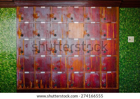 Old cherry wood locker in grungy retro looks.