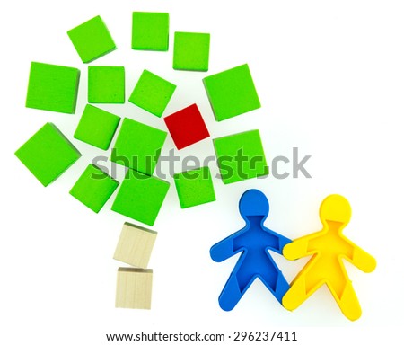 Colorful wooden blocks to put together a model from Apple and the doll representing the first man and woman.