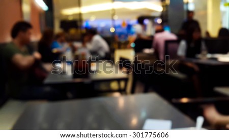 Bokeh in the restaurant with dim lights for a blurred background.