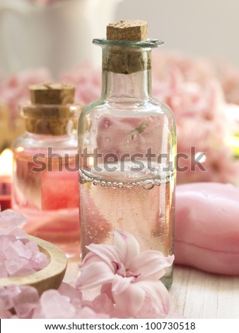 pink spa arrangement with vintage glass bottles