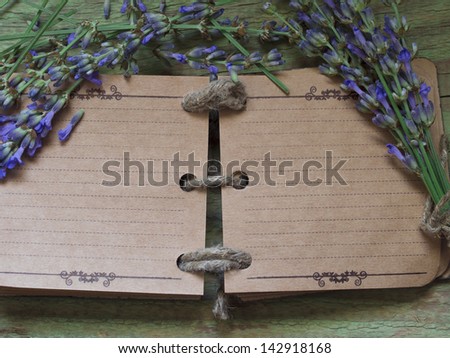 open blank notebook with rosemary and lavender decoration