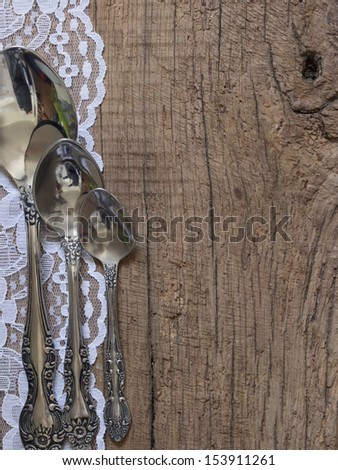 spoons on the wooden background, place for the text