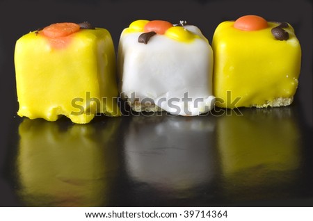 yellow and white cakes on black