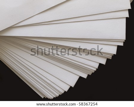 stack of plain paper on black