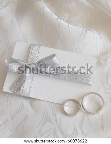 white gold wedding rings on wedding card