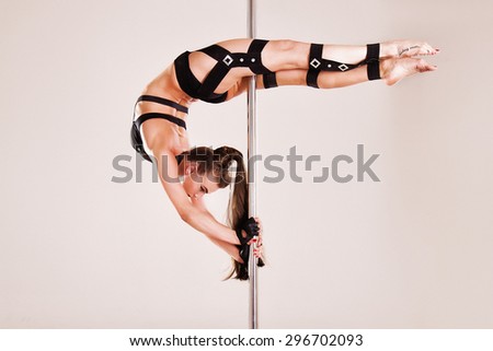 Pole Dance in studio on white background
