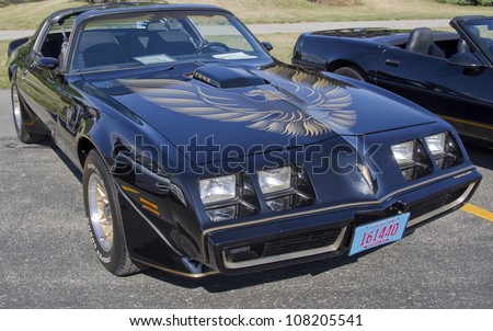 APPLETON, WI - JULY 21:  A 1980 black Pontiac Firebird Trans Am with emblem on hood of the car at the 18th Annual WVBO Classic Car Show on July 21, 2012 in Appleton, Wisconsin.