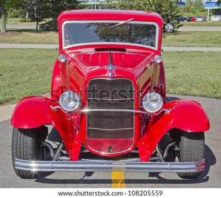 APPLETON, WI - JULY 21:  The front of a beautiful red Ford Hot Rod car at the 18th Annual WVBO Classic Car Show and Cruise at Fox Valley Technical College on July 21, 2012 in Appleton, Wisconsin.