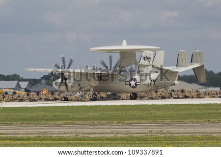 OSHKOSH, WI - JULY 27: A U.S. Military AWAC (Advanced Warning and Control) plane starting to lift off the runway at the 2012 AirVenture at EAA on July 27, 2012 in Oshkosh, Wisconsin.