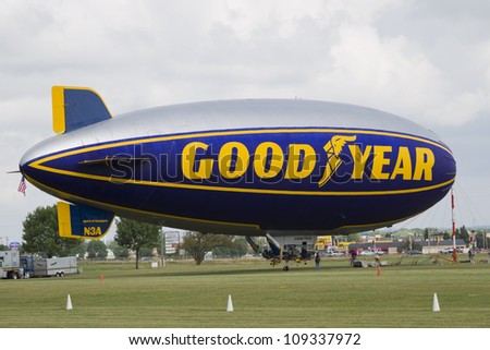 OSHKOSH, WI - JULY 27: The Good Year blimp Zeppelin, Spirit of Goodyear (with distinctive yellow stripe), gets ready to fly high over the 2012 AirVenture at EAA on July 27, 2012 in Oshkosh, Wisconsin.