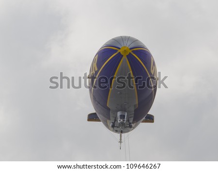 OSHKOSH, WI - JULY 27: Front view of the Good Year blimp Zeppelin, Spirit of Goodyear, flies high over the 2012 AirVenture at EAA on July 27, 2012 in Oshkosh, Wisconsin.