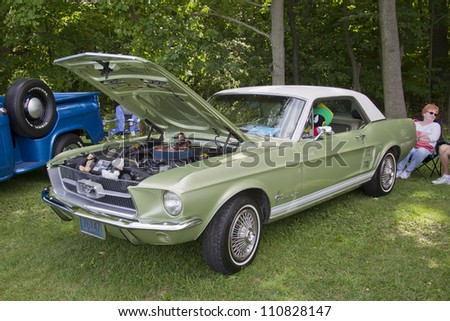 COMBINED LOCKS, WI - AUGUST 18:  Side view of a light green 1967 Ford Mustang  car at the 2nd Annual Horizon of Hope Generations Car and Truck Show on August 18, 2012 in Combined Locks, Wisconsin.