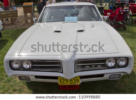 COMBINED LOCKS, WI - AUGUST 18: Front view of a white 1969 Pontiac GTO classic car at the 2nd Annual Horizon of Hope Generations Car and Truck Show on August 18, 2012 in Combined Locks, Wisconsin.