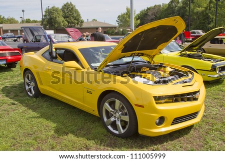 COMBINED LOCKS, WI - AUGUST 18: Side view of a yellow 2010 Chevy Camaro classic car at the 2nd Annual Horizon of Hope Generations Car and Truck Show on August 18, 2012 in Combined Locks, Wisconsin.