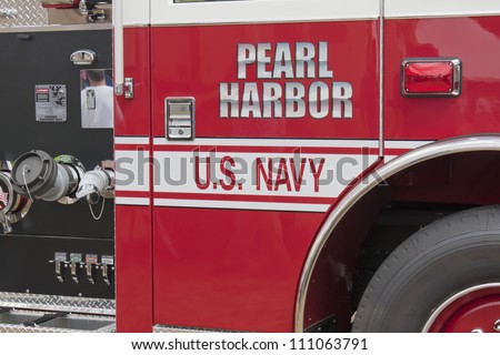OSHKOSH, WI - JULY 27:  Close up of a Pierce red & white Fire Truck marked US Navy Pearl Harbor on display the 2012 AirVenture at EAA on July 27, 2012 in Oshkosh, Wisconsin.