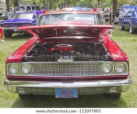 WAUPACA, WI - AUGUST 25: Front view of a 1963 red Ford Fairlane car at the 10th Annual Waupaca Rod & Classic Car Club Car Show on August 25, 2012 in Waupaca, Wisconsin.