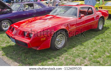 COMBINED LOCKS, WI - AUGUST 18: Side view of a red Pontiac Trans Am Firebird classic car at 2nd Annual Horizon of Hope Generations Car and Truck Show on August 18, 2012 in Combined Locks, Wisconsin.