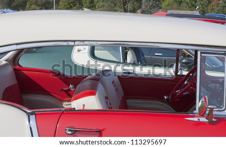 MARION, WI - SEPTEMBER 16: Passenger side view of Red & White 1955 Chevy Bel Air car at the 3rd Annual Not Just Another Car Show on September 16, 2012 in Marion, Wisconsin.