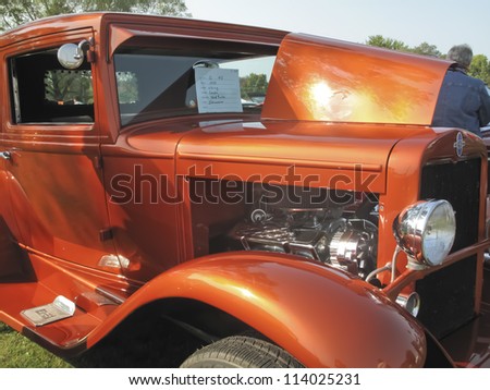 MARION, WI - SEPTEMBER 16: Front side of 1930 Orange Chevy Coupe car at the 3rd Annual Not Just Another Car Show on September 16, 2012 in Marion, Wisconsin.