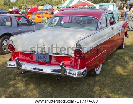 MARION, WI - SEPTEMBER 16: Back of 1955 Red & White Ford Crown Victoria Fairlane Fordomatic car at the 3rd Annual Not Just Another Car Show on September 16, 2012 in Marion, Wisconsin.