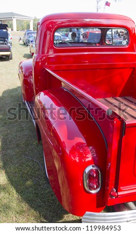 MARION, WI - SEPTEMBER 16: Side Profile of  1952 Red Ford Pickup Truck at the 3rd Annual Not Just Another Car Show on September 16, 2012 in Marion, Wisconsin.