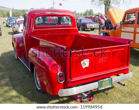 MARION, WI - SEPTEMBER 16: Back of 1952 Red Ford Pickup Truck at the 3rd Annual Not Just Another Car Show on September 16, 2012 in Marion, Wisconsin.