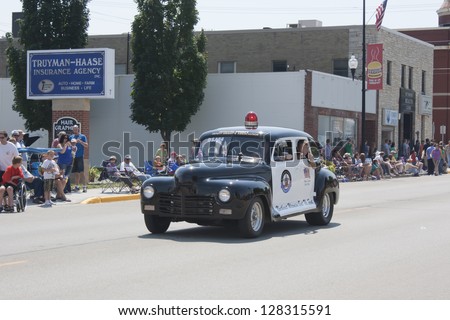 SEYMOUR, WI - AUGUST 4:  Coming down the street Outagamie County Old Fashion Police Car at the Annual Hamburger Festival Parade on August 4, 2012 in Seymour, Wisconsin.