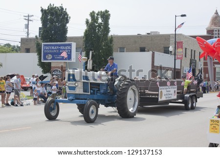 SEYMOUR, WI - AUGUST 4:  American Legion Post 106 Seymour Veterans on a tractor at the Annual Hamburger Festival Parade on August 4, 2012 in Seymour, Wisconsin.