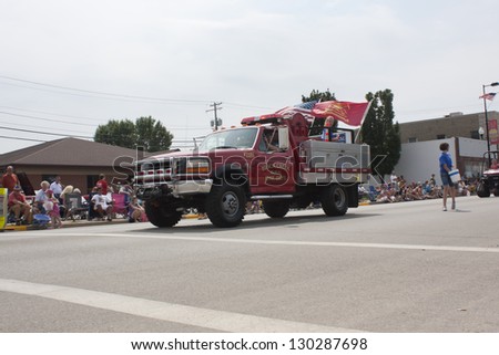 SEYMOUR, WI - AUGUST 4:  Flags fly on Black Creek Rural Fire Department Smaller Truck at the Annual Hamburger Festival Parade on August 4, 2012 in Seymour, Wisconsin.