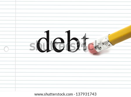 The word debt written on notebook paper with the end of a pencil erasing the black letters showing eraser marks making a great concept.