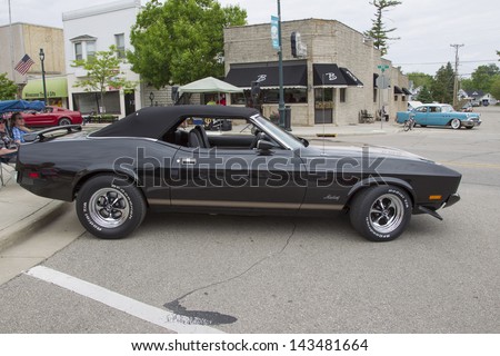 WINNECONNE, WI - JUNE 1:  Side of a 1973 Ford Mustang black convertible Car at Annual Car Show on Main Street June 1, 2013 in Winneconne, Wisconsin.