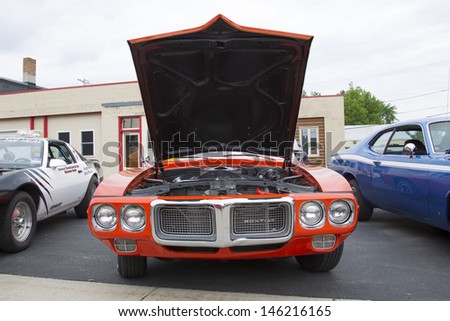 WINNECONNE, WI - JUNE 1:  Front view of a Red 1969 Pontiac Firebird car at Annual Car Show on Main Street June 1, 2013 in Winneconne, Wisconsin.
