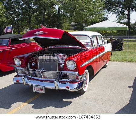 WAUPACA, WI - AUGUST 24:  A red and white1956 Chevy Bel Air car at Waupaca Rod and Classic Annual Car Show August 24, 2013 in Waupaca, Wisconsin.