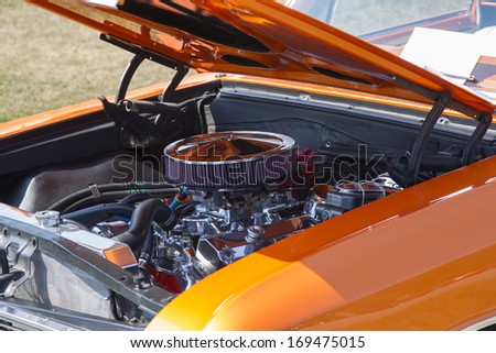 WAUPACA, WI - AUGUST 24, 2013:  Engine of 1966 Orange Chevy El Camino car at Waupaca Rod and Classic Annual Car Show August 24, 2013 in Waupaca, Wisconsin.