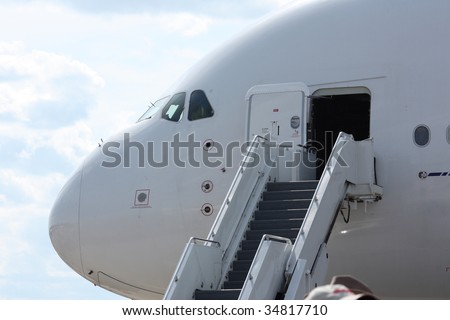Rolling stairs placed at the airplane doors, ready for boarding