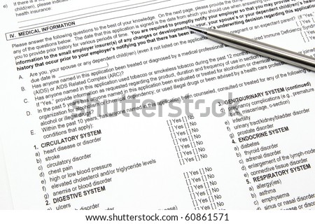 A health insurance application medical information section with a pen ready to be filled out.