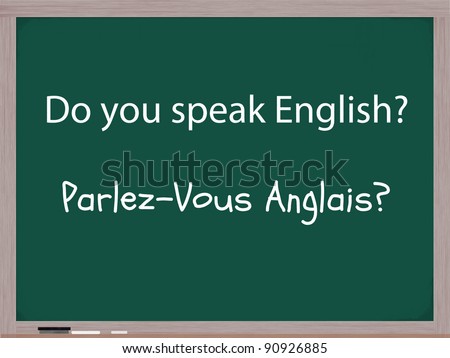 The words Do You Speak English and the French translation of Parlez-Vous Anglais written on a blackboard in chalk with an eraser at the bottom of the board.