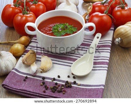 summer gazpacho soup with vegetables on wooden table