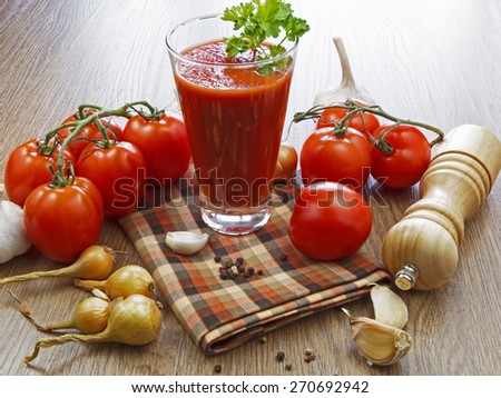 summer gazpacho soup with vegetables on wooden table
