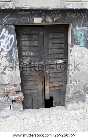LODZ,POLAND-JUNE 28: very old and broken door on the side of the road ,Poland\'s second largest city, is the largest industrial city on June 28 ,2010 in Lodz , Poland.